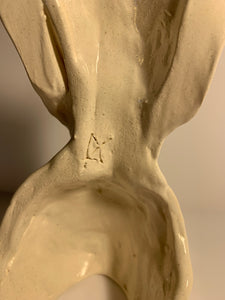Faceless lady, White glazed sculpture. AGE