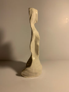 Faceless lady, White glazed sculpture. AGE