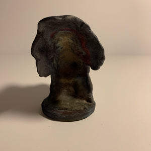 Raku clay sculpture, staring face. AGE